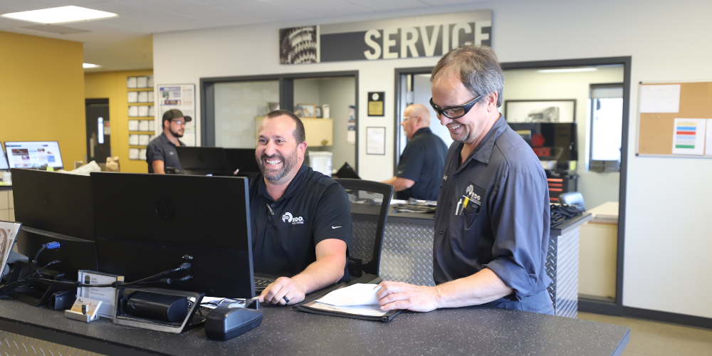 Diesel Technician working with a Service Advisor.